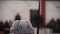 Ice hockey player sitting on the bench, watching match, waiting for instructions