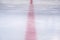 Ice of a hockey rink cut by skates. Empty ice arena.