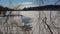 Ice-hole in a frozen lake in Mont Saint Bruno na national park, Quebec