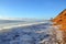 Ice hummocks near the sandy slope of the coast