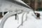 Ice icicles on the railing. Icy condition.