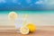 Ice lemonade summer drink , blur ocean beach on background