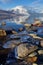 Ice-Locked Rocks on the Warming Wintery Shores of Lake McDonald at Glacier National Park, Montana, USA