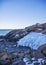 Ice on Marginal way in Ounquit on rocky coast of Maine on Atlantic Ocean in winter