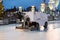 : Ice Resurfacer in action at the VDNKH park ice rink. Ice polishing process at the rink. Ice-filling machine