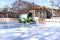 An ice rink cleaning machine polishes the ice surface. City skating rink on a winter day. Plovdiv, Bulgaria. cityscape