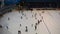 Ice rink in Dubai Mall, world`s largest shopping mall. Top view. Many people skate on ice rink in Dubai Mall.