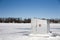 Ice Shanty on a Frozen Lake