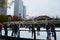 Ice skating in Chicago with tourist attraction and skyscrapers in the background