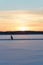 Ice skating in skandinavien winter sunset on frozen lake