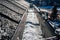 Ice and snow building up inside a rooftop gutter system on a residential house