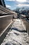 Ice and snow building up inside a rooftop gutter system on a residential house