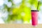 Ice tea,iced pink milk tea on green nature background