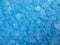 Ice texture with frozen liquid on the blue background