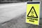 Ice untreated road sign dangerous warning for highway car drivers