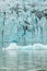 Ice wall and icebergs in Fjallsarlon glacier lagoon, abstract landscape Iceland