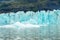 Ice wall and icebergs in Fjallsarlon glacier lagoon, abstract landscape Iceland