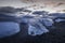 Ice washed up on Iceland black sand beach