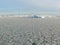 Iceberg among Antarctic Patterns pancake ice in Ross Sea Antarctica