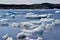 Iceberg bits stranded along the shore at Twillingate Harbour