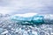 Iceberg with blue ice and covered by snow in Antarctica, scenic frozen landscape in Antarctic Peninsula