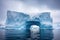 iceberg calving from glacier into sea
