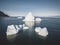 An Iceberg Of Colossal Size In The Form Of A Castle seen from above aerial. Floats In The Cold Waters Of Greenland in