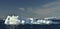 Iceberg in Disko Bay. Western Greenland. Blue sky background.  Misty morning