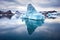 iceberg floating in a calm glacial lagoon