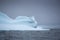 iceberg floating in the sea in Antarctica, looking like human face