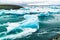 Iceberg floating in the water at Jokulsarlon Black Beach