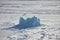 Iceberg in frozen Arctic Ocean