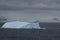 Iceberg glowing in overcast dawn