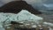 Iceberg hole and glacier tongue with lake