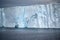 Iceberg, huge table iceberg, tabular iceberg with texture in dark rough Southern Ocean, Antarctica