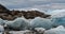 Iceberg and ice from glacier in dramatic arctic nature landscape on Greenland