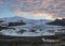 Iceberg lagoon Fjallsarlon with floating icebergs and dramatic sky reflection in water, Vatnajokull National Park, Southern Icelan