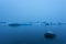 Iceberg in lagoon at midnight. Long exposure