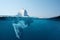 Iceberg in the ocean with a view under water. Crystal clear water. Hidden Danger And Global Warming Concept.