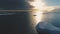 Iceberg in sunset above Antarctica. Front aerial tracking view.