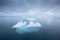 Iceberg at sunset. Nature and landscapes of Greenland. Disko bay. West Greenland. Summer Midnight Sun and icebergs.