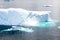 Iceberg with turquoise shining water, Greenland