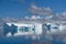 Icebergs in Antarctica, huge table iceberg, tabular iceberg with gate and reflections