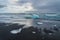 Icebergs on a black sand Jokulsarlon beach, Iceland