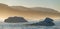 Icebergs in Disko Bay. Western Greenland. Blue sky background. Misty morning