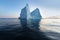 Icebergs in front of the fishing town Ilulissat in Greenland. Nature and landscapes of Greenland. Travel on the vessel among ices.