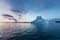 Icebergs in front of the fishing town Ilulissat in Greenland. Nature and landscapes of Greenland. Travel on the vessel among ices.