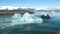 Icebergs and global warming. Icebergs are melting in the turquoise bay. Ice glacier in polar environment. Arctic