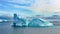 Icebergs in Greenland. Colorful huge Iceberg building with tower and gate.