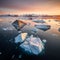 Icebergs in Greenland in the soft sunset light, top view